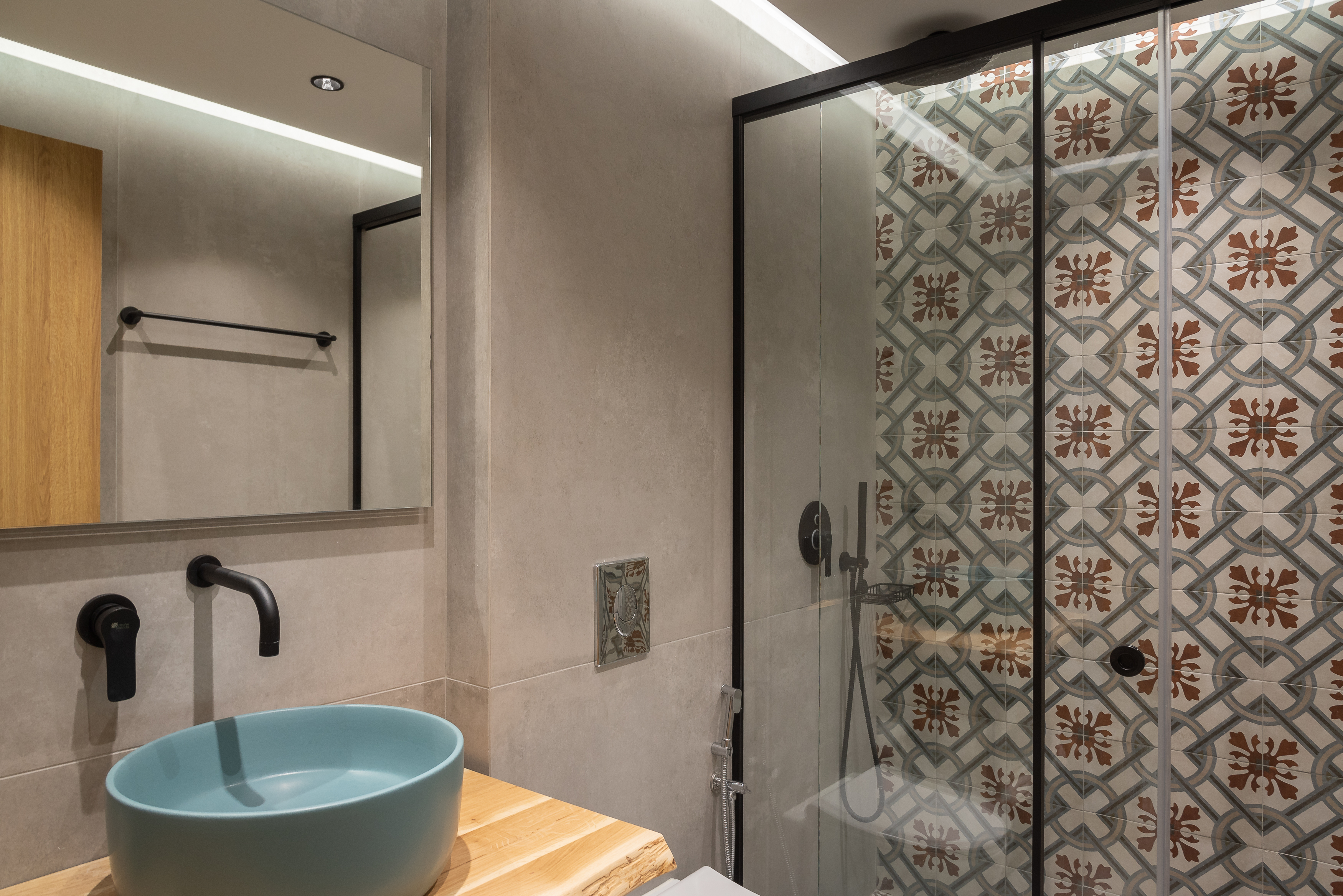 The bathroom features a walk in shower.