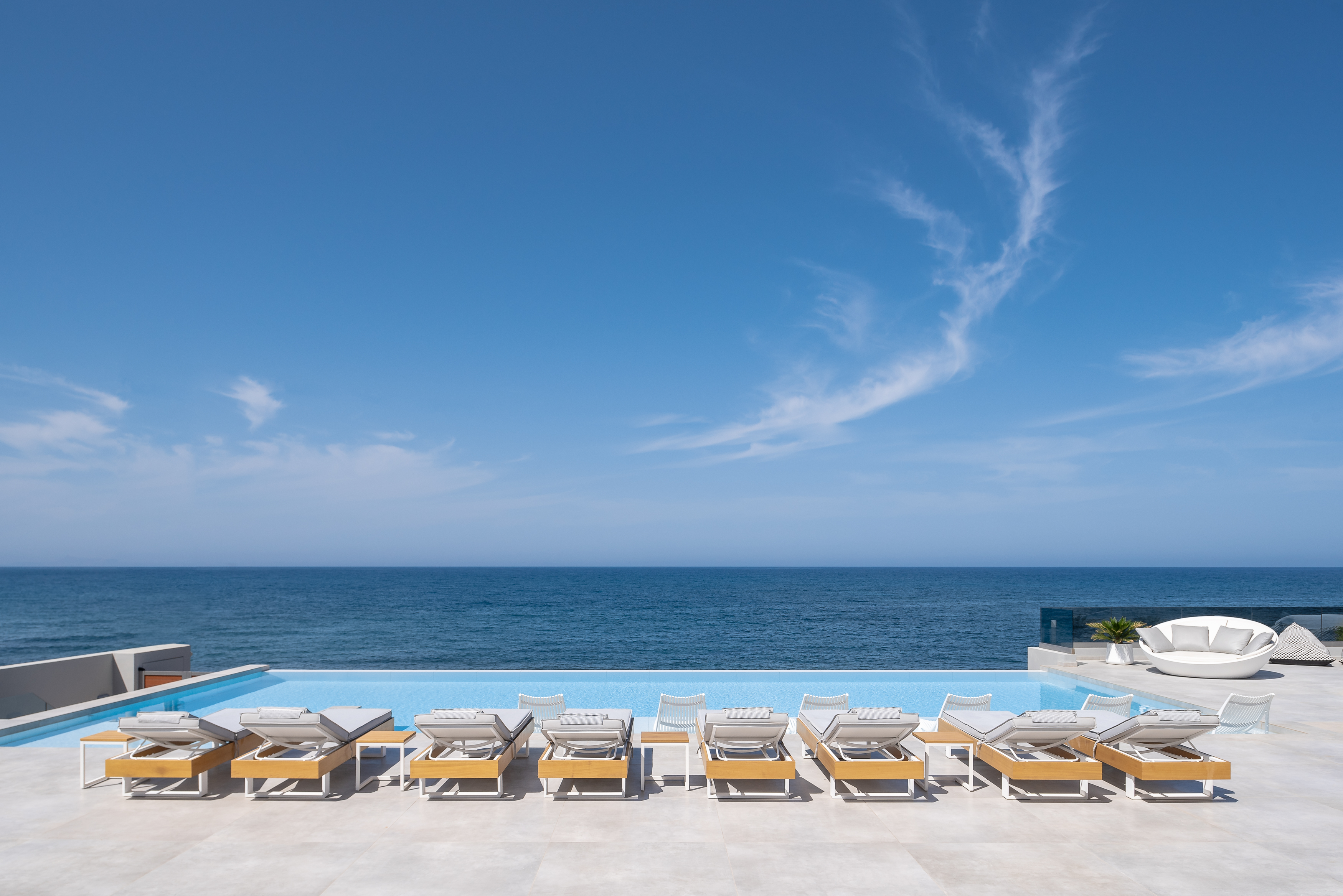 The pool terrace is equipped with high quality sun beds and umbrellas.