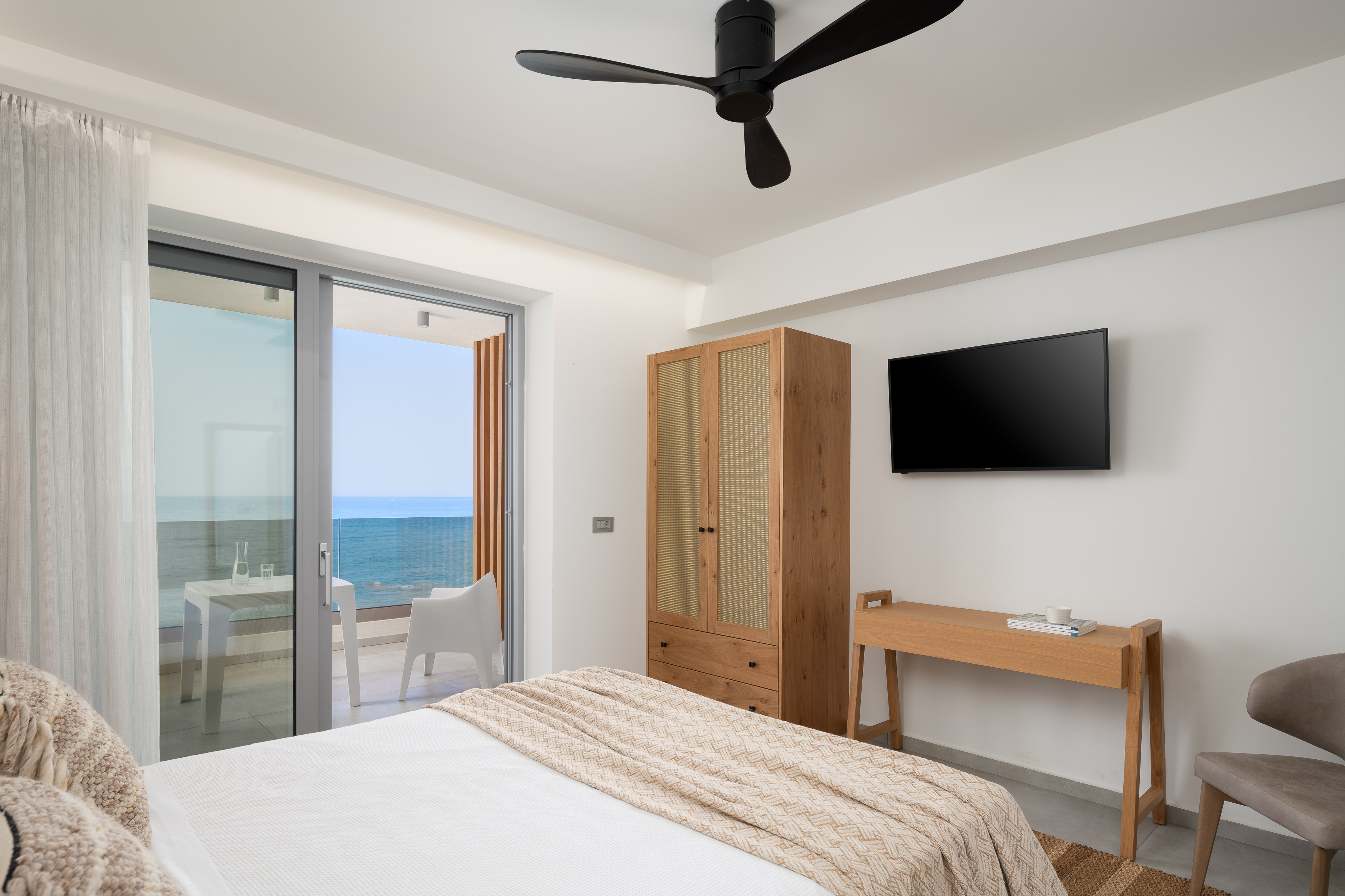 Fluffy pillows and dreamy sea views at Villa Hermes .